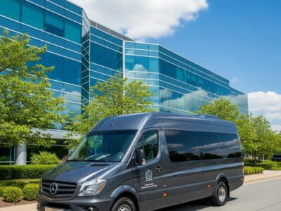 Corporate shuttle parked outside an office building — dependable, professional transportation